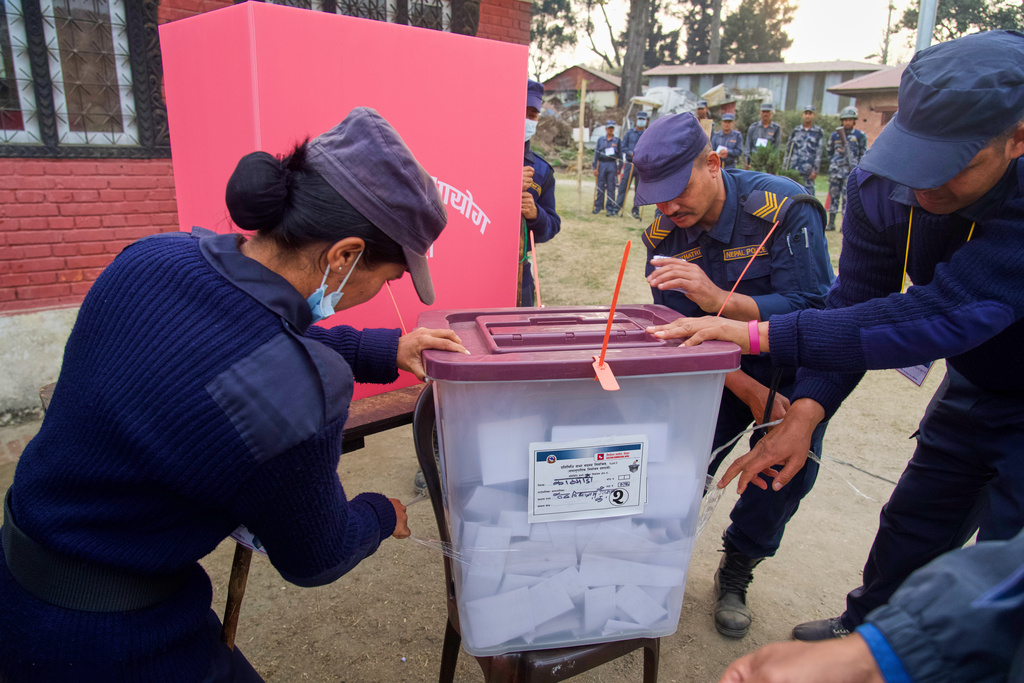 Police personals close the ballot box at the end of the polling during the parliamentary election in Kathmandu, Nepal, Thursday, March 5, 2026. (AP Photo/Niranjan Shrestha)