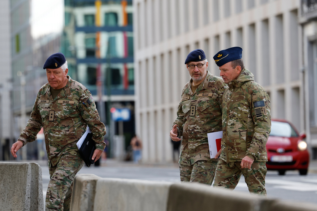 From left, General-major Stephane Dutron, Chief of Drones and Innovation Taskforce Lt. General Michel Van Strythem and General Frederik Vansina arrive for a meeting of the National Security Council in Brussels, after recent drone sightings in Belgium, Thursday, Nov. 6, 2025. (AP Photo/Geert Vanden Wijngaert)