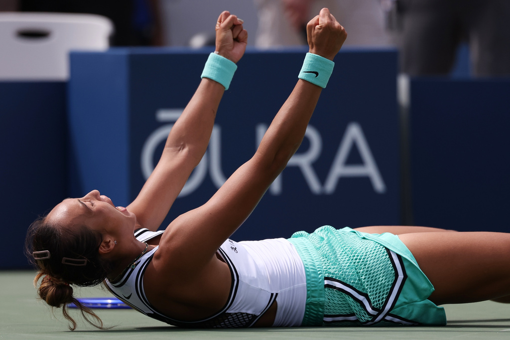 Zheng Qinwen, of China, celebrates after she won her match against Madison Keys, of the United States, during the third round of the U.S. Open tennis championships Saturday, Sept. 5, 2026, in New York. (AP Photo/Heather Khalifa)