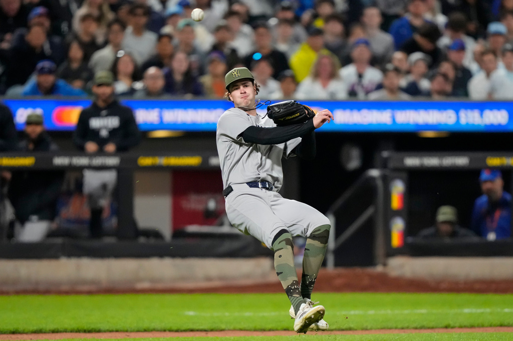 New York Yankees starting pitcher Cam Schlittler throws out New York Mets' Mark Vientos at first base during the fourth inning of a baseball game, Friday, May 15, 2026, in New York. (AP Photo/Yuki Iwamura)