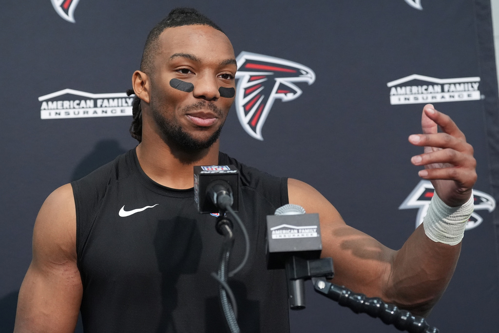 Atlanta Falcons running back Bijan Robinson speaks during a news conference after an NFL football game against the Arizona Cardinals, Sunday, Dec. 21, 2025, in Glendale, Ariz. (AP Photo/Ross D. Franklin)