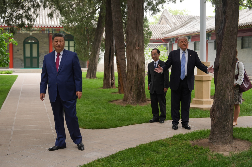 President Donald Trump walks with China's President Xi Jinping at the Zhongnanhai leadership compound, Friday, May 15, 2026, in Beijing. (AP Photo/Mark Schiefelbein, Pool)