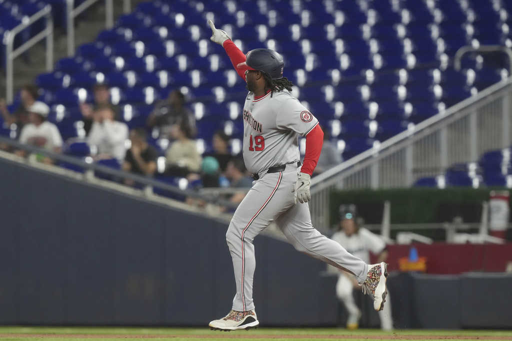 Washington Nationals' Josh Bell (19) gestures to the bullpen after hitting a three-run home run during the first inning of a baseball game against the Miami Marlins Tuesday, Sept. 9, 2025, in Miami. (AP Photo/Marta Lavandier)