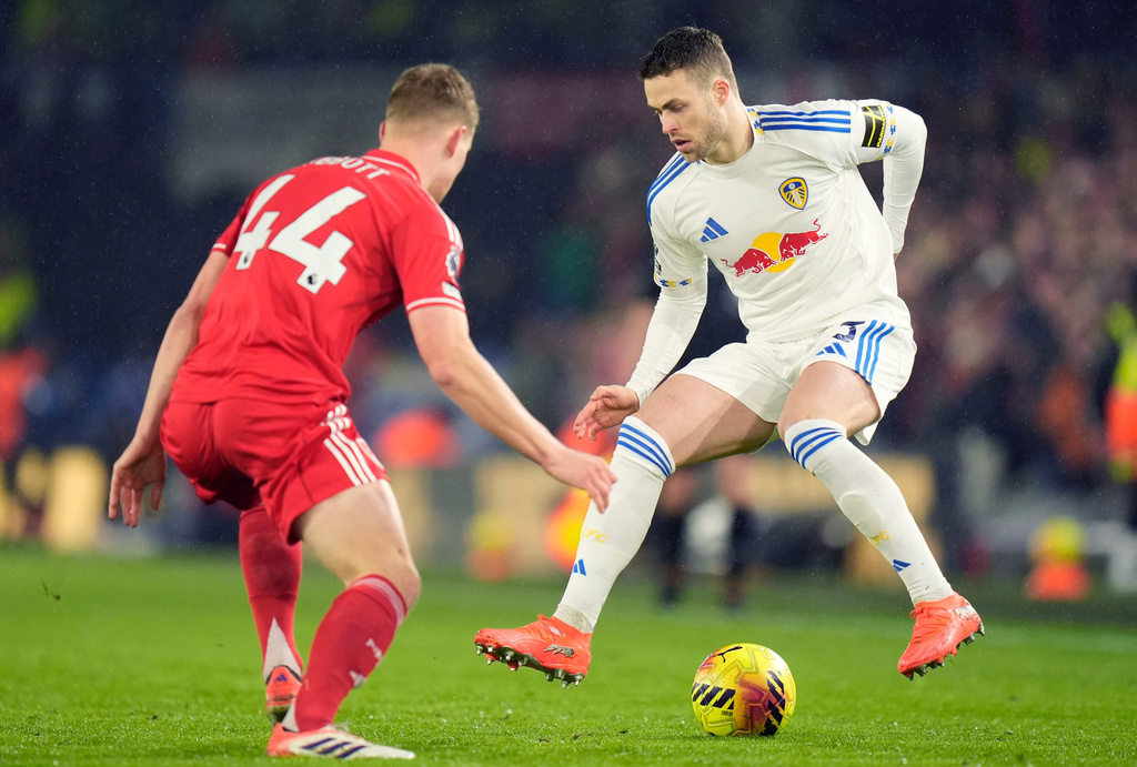 Leeds United's Gabriel Gudmundsson, right, controls the ball as Nottingham Forest's Zach Abbott moves in during the English Premier League soccer match between Leeds United and Nottingham Forest in Leeds, England, Friday Feb. 6, 2026. (Danny Lawson/PA via AP)