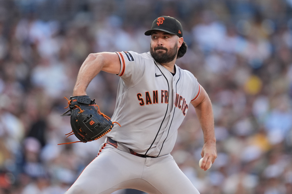 San Francisco Giants starting pitcher Robbie Ray works against a San Diego Padres batter during the first inning of a baseball game Thursday, July 30, 2026, in San Diego. (AP Photo/Gregory Bull)