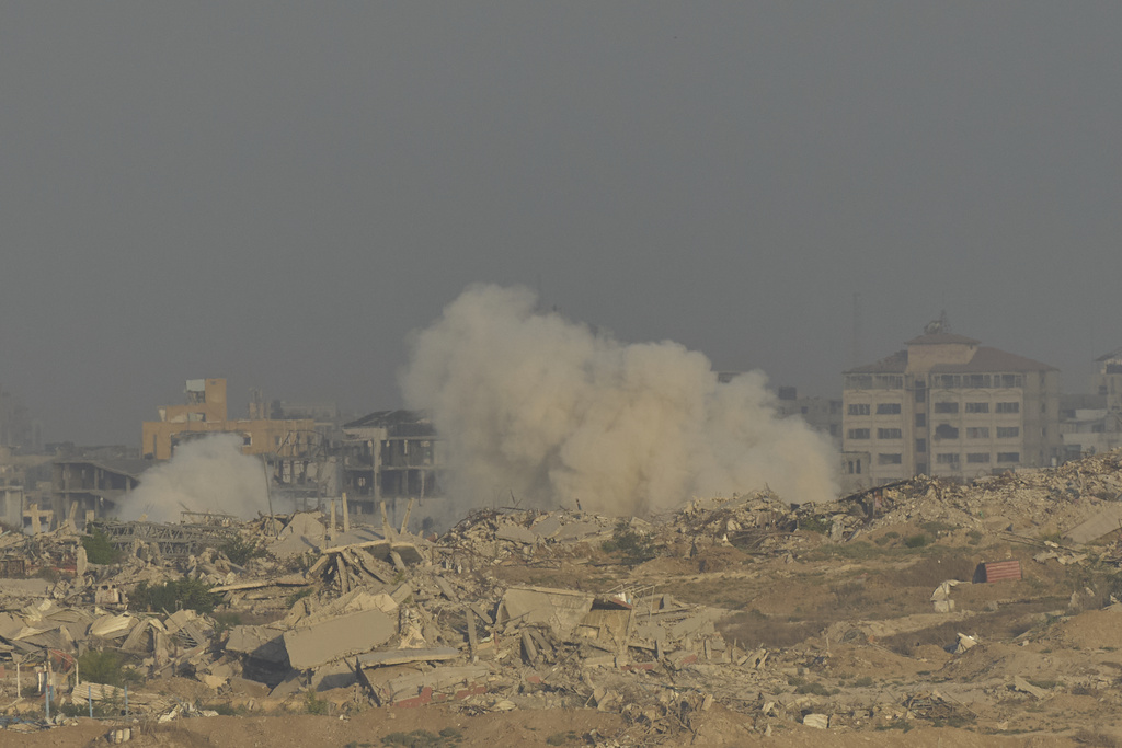 Smoke rises following an explosion in the Gaza Strip, as seen from southern Israel, Sunday, Sept. 21, 2025. (AP Photo/Ohad Zwigenberg)
