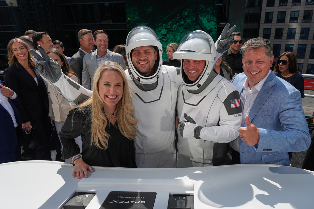 SpaceX executives celebrate with employees during a closing bell ceremony for the IPO of SpaceX at the Nasdaq MarketSite in New York, Friday, June 12, 2026, in New York. (AP Photo/Frank Franklin II)