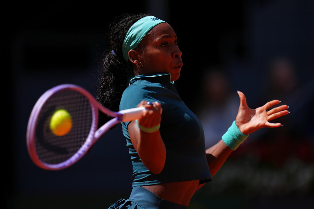 Coco Gauff of the U.S. returns the ball to Sorana Cirstea of Romania during the Madrid Open tennis tournament in Madrid, Sunday, April 26, 2026. (AP Photo/Manu Fernandez)