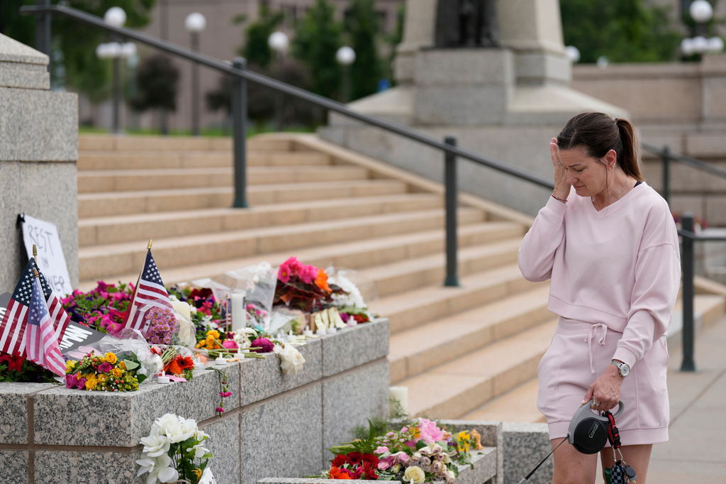 FILE - Leah Palmer visits a makeshift memorial for Minnesota state Rep. Melissa Hortman and her husband Mark at the state Capitol, June 15, 2025, in St. Paul, Minn. (AP Photo/George Walker IV, File)