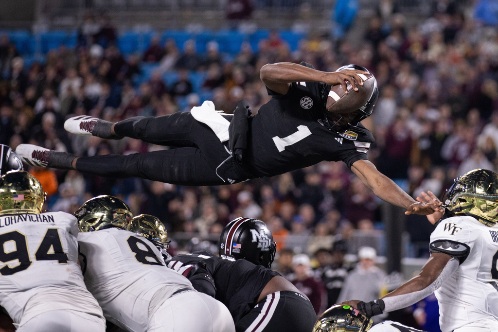 Mississippi State quarterback Kamario Taylor (1) dives for a touchdown against Wake Forest in the second half of the Duke's Mayo Bowl NCAA college football game, Friday, Jan. 2, 2026, in Charlotte, N.C. (AP Photo/Scott Kinser)