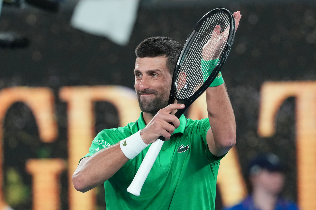 Novak Djokovic of Serbia celebrates after defeating Pedro Martinez of Spain in their first round match at the Australian Open tennis championship in Melbourne, Australia, Monday, Jan. 19, 2026. (AP Photo/Aaron Favila)