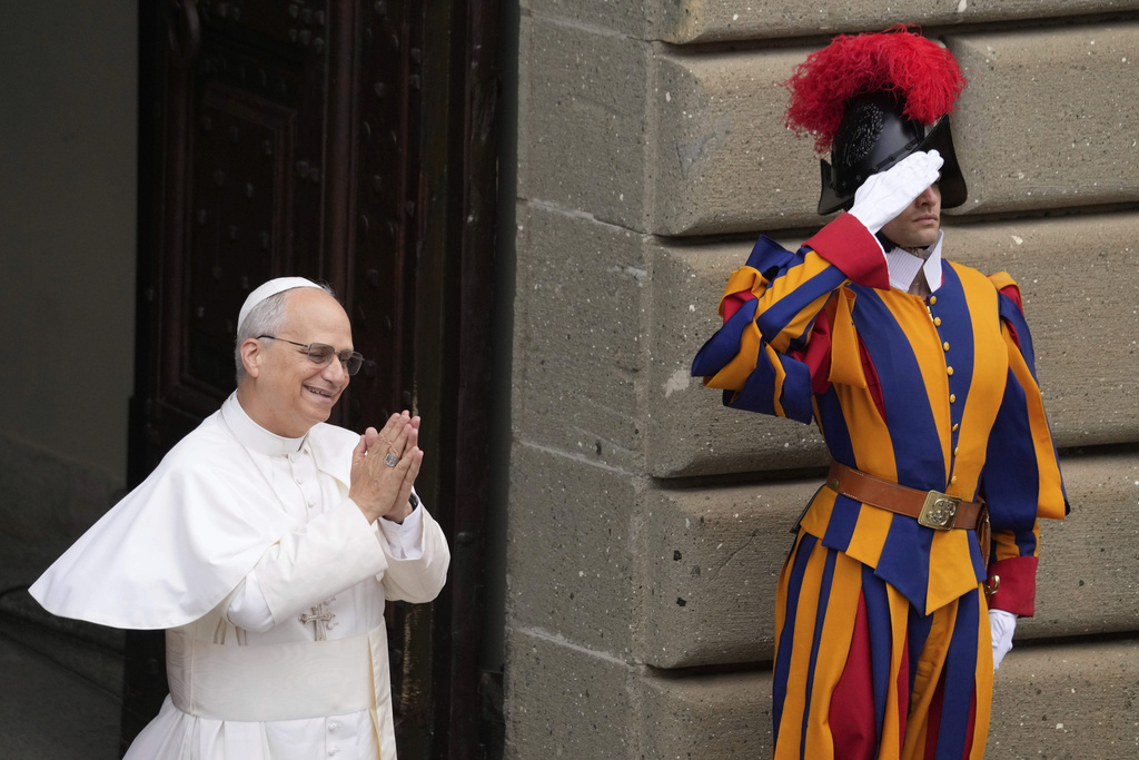 Pope Leo XIV greets faithful at the end of the Angelus prayer in Castel Gandolfo, Italy Sunday, Aug. 17, 2025. (AP Photo/Gregorio Borgia)