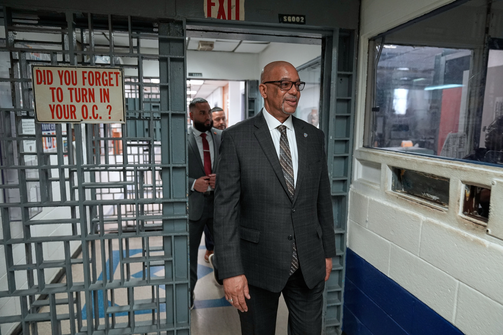 Stanley Richards, NYC Department of Correction commissioner, walks through security in the building where he was previously incarcerated on Rikers Island in New York, Tuesday, April 14, 2026. (AP Photo/Seth Wenig)