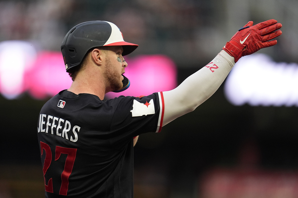 Minnesota Twins' Ryan Jeffers (27) celebrates after hitting a triple during the first inning of a baseball game against the Detroit Tigers Tuesday, Sept. 1, 2026, in Minneapolis. (AP Photo/Abbie Parr)