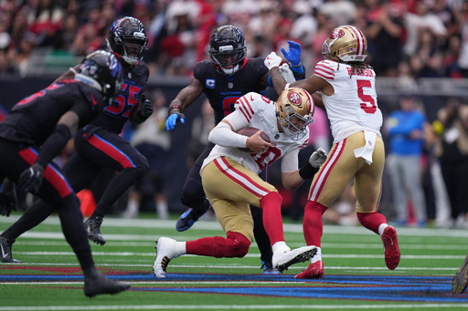 San Francisco 49ers quarterback Mac Jones (10) runs for a first down during the second half of an NFL football game against the Houston Texans Sunday, Oct. 26, 2025, in Houston. (AP Photo/Eric Gay) San Francisco 49ers quarterback Mac Jones (10) runs for a first down during the second half of an NFL football game against the Houston Texans Sunday, Oct. 26, 2025, in Houston. (AP Photo/Eric Gay)
