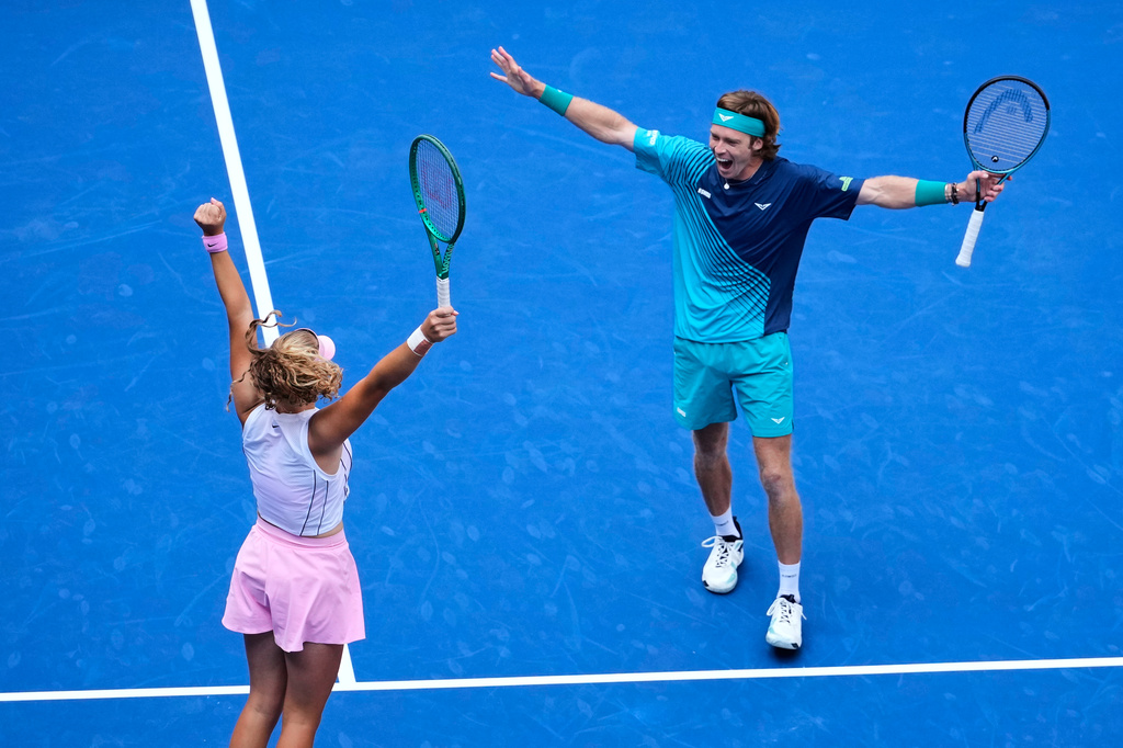 Mirra Andreeva, of Russia, and Andrey Rublev, of Russia, react after winning a mixed doubles match at the U.S. Open tennis championships, Tuesday, Aug. 25, 2026, in New York. (AP Photo/Yuki Iwamura)