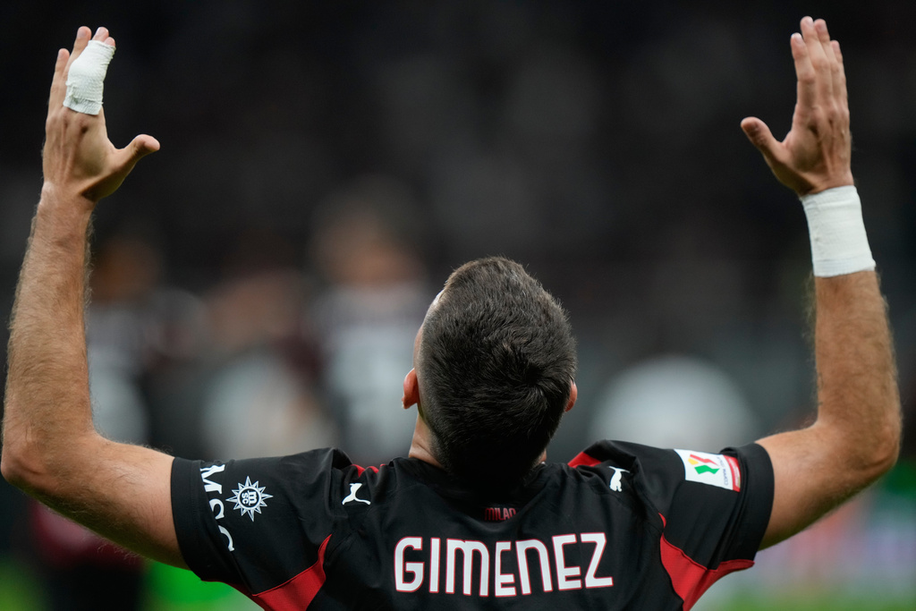 AC Milan's Santiago Gimenez celebrates after scoring against Lecce during an Italian Cup qualifying soccer match between AC Milan and Lecce, at the San Siro stadium in Milan, Italy, Tuesday, Sept. 23, 2025. (AP Photo/Luca Bruno)