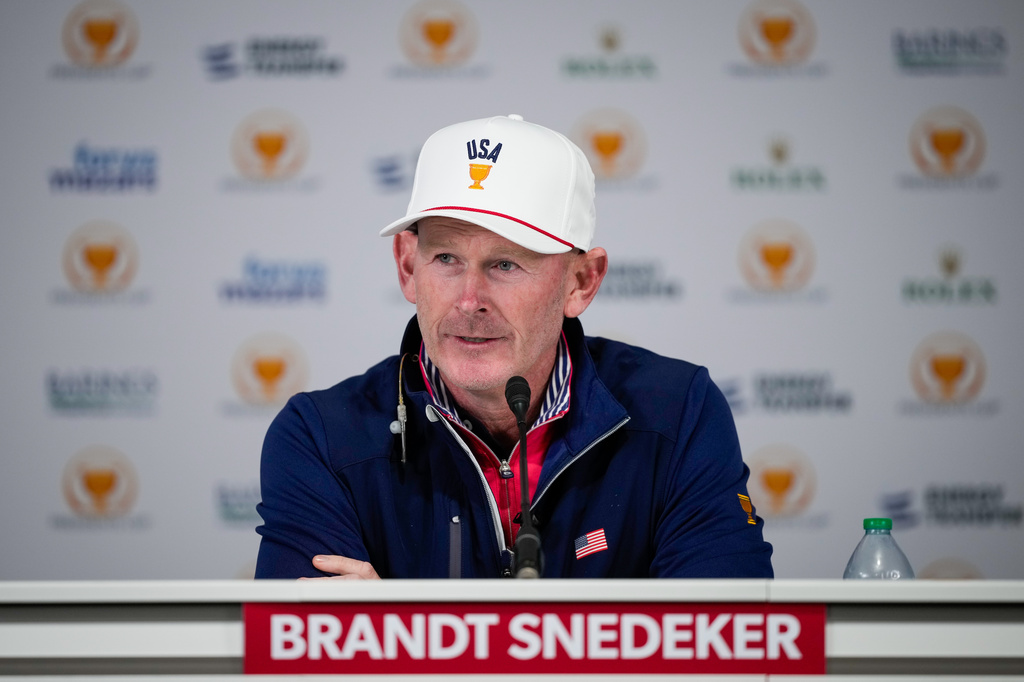 USA team captain Brandt Snedeker speaks prior to the start of the Presidents Cup golf tournament against the International team at Medinah Country Club, Tuesday, Sept. 22, 2026, in Medinah, Ill. (AP Photo/Matt Slocum)
