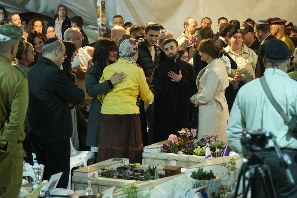 Freed hostage Matan Angrest attends the funeral of slain hostage Captain Daniel Peretz at Mt. Herzl military cemetery in Jerusalem, Wednesday, Oct. 15, 2025. (AP Photo/Francisco Seco)