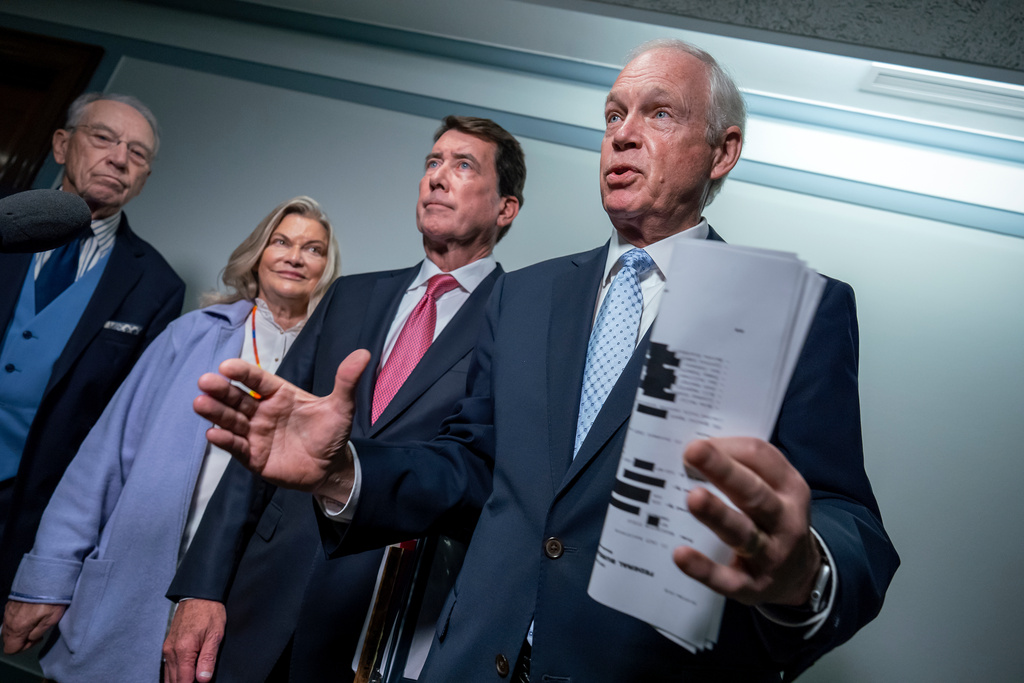 From left, Senate Judiciary Committee Chairman Chuck Grassley, R- Iowa, Sen. Cynthia Lummis, R-Wyo., Sen. Bill Hagerty, R-Tenn., and Sen. Ron Johnson, R-Wis., chairman of the Permanent Subcommittee on Investigations, speak with reporters as they make an announcement about their oversight of the FBI, at the Capitol in Washington, Monday, Oct. 6, 2025. (AP Photo/J. Scott Applewhite)