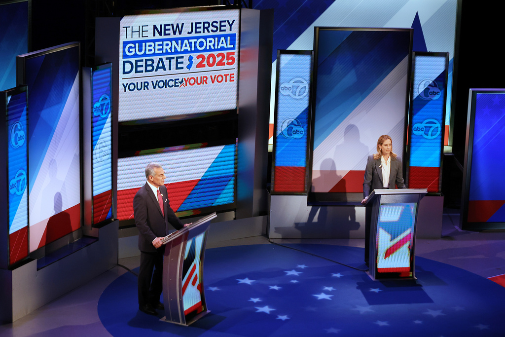 Republican Jack Ciattarelli, left, and Democrat Mikie Sherrill participate in the final debate in the New Jersey governor's race, Wednesday, Oct. 8, 2025, in New Brunswick, N.J. (AP Photo/Heather Khalifa)