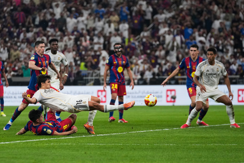 Real Madrid's Gonzalo Garcia scores against FC Barcelona during the Spanish Super Cup final soccer match at King Abdullah Sports City Stadium in Jeddah, Saudi Arabia, Sunday, Jan. 11, 2026. (AP Photo/Altaf Qadri)