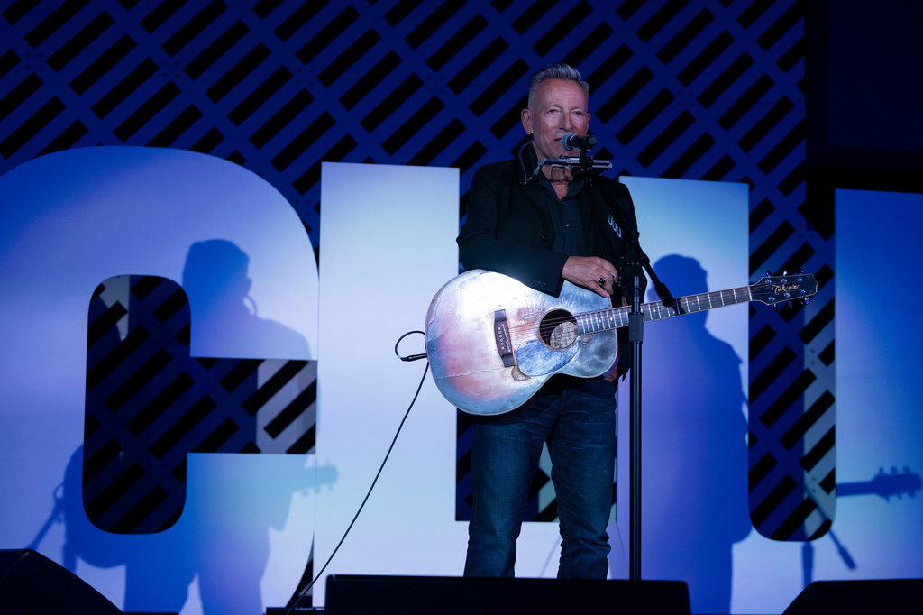 Bruce Springsteen performs on stage after recieving the ACLU Ralph Ellison Award for Defenders of Civil Rights and Civil Liberties in the Arts, Business, Science, and Sports at the ACLU's 2026 Biennial Leadership Conference,Friday, July 24, 2026, in Washington. (AP Photo/Kevin Wolf)