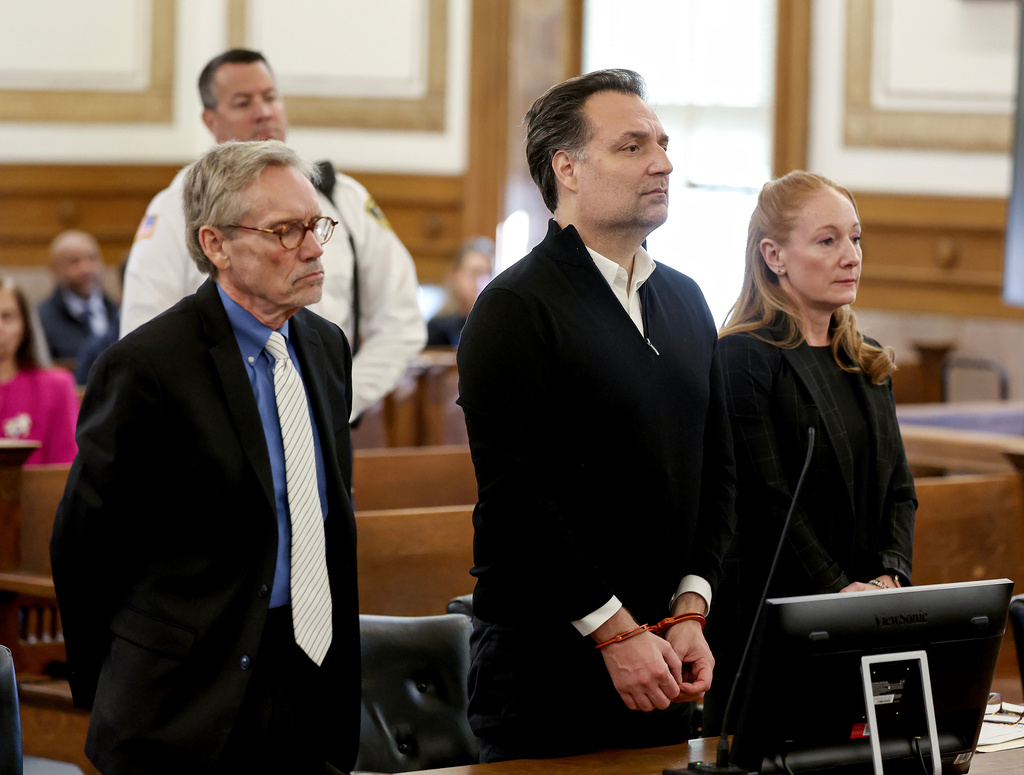 Brian Walshe, center, is sentenced in Norfolk Superior Court in Dedham, Mass., on Thursday, Dec. 18, 2025. (Mark Stockwell/Boston Herald via AP, Pool)