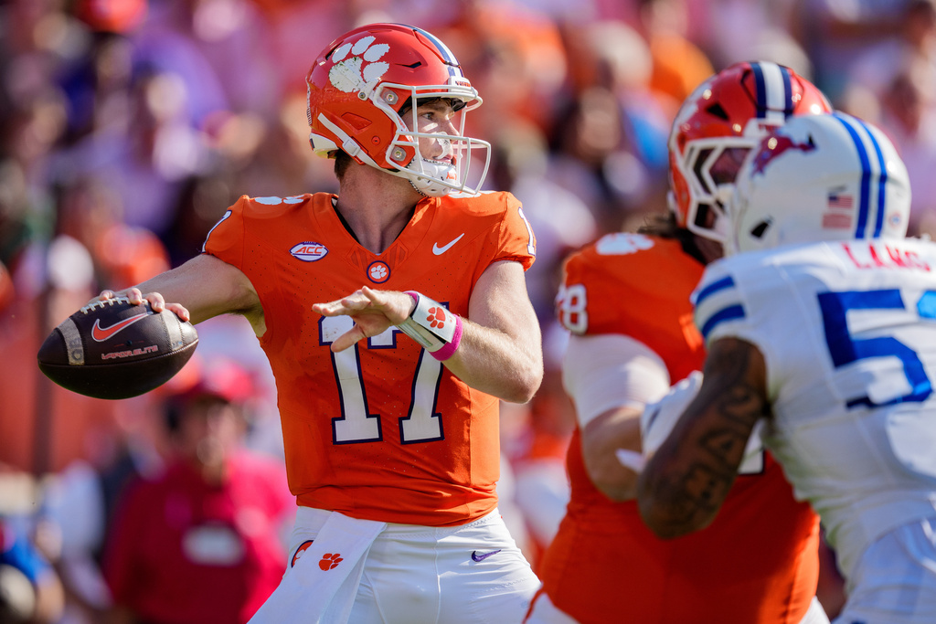 Clemson quarterback Christopher Vizzina (17) passes the ball in the first half of an NCAA college football game against SMU, Saturday, Oct. 18, 2025, in Clemson, S.C. (AP Photo/Jacob Kupferman)