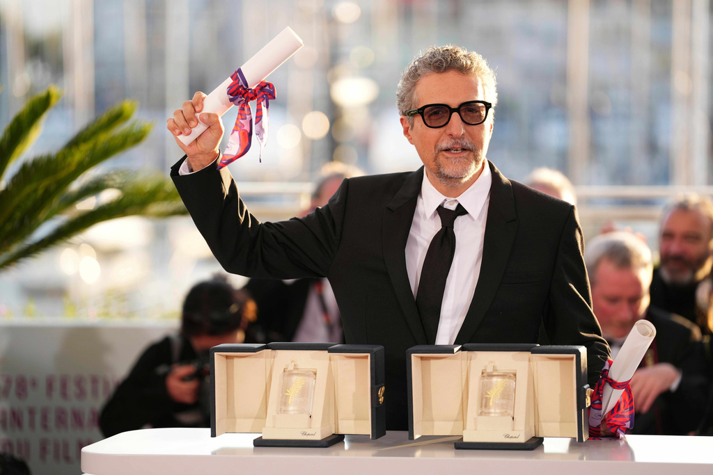 FILE - Director Kleber Mendonca Filho poses with his award for best director for the film "The Secret Agent" as well as the best actor award received on behalf of Wagner Moura at the awards ceremony photo call at the 78th international film festival, Cannes, France, May 24, 2025. (Photo by Scott A Garfitt/Invision/AP, File)