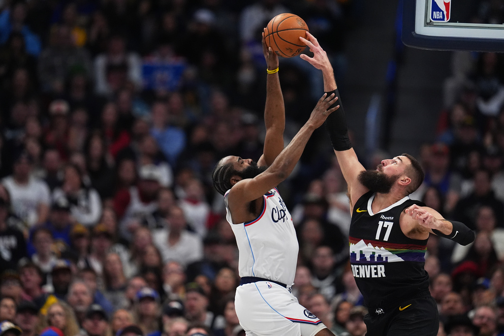 Denver Nuggets center Jonas Valančiūnas, right, blocks a shot by Los Angeles Clippers guard James Harden, left, in the first half of an NBA basketball game Friday, Jan. 30, 2026, in Denver. (AP Photo/David Zalubowski)