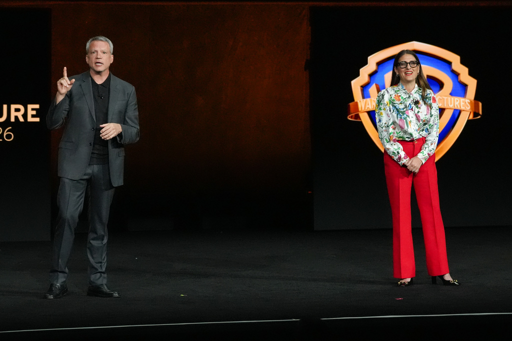 Mike De Luca, left, and Pam Abdy, Co-Chairs and CEOs of Warner Bros. Motion Picture Group, speak during the Warner Bros. presentation at CinemaCon on Tuesday, April 14, 2026, at Caesars Palace in Las Vegas. (AP Photo/Chris Pizzello)