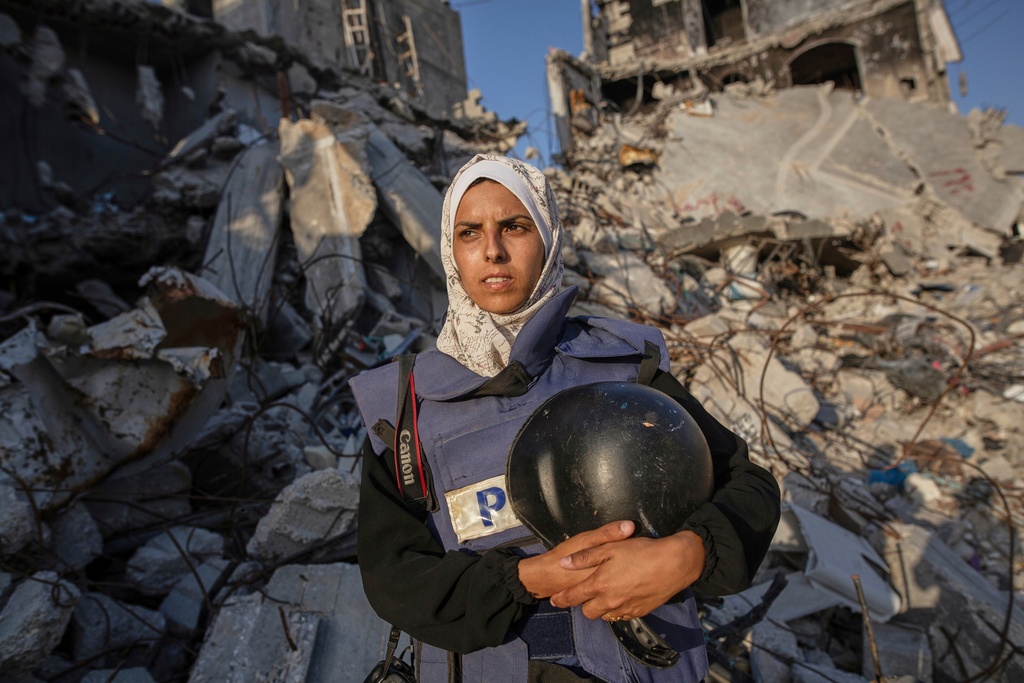 FILE - Freelance journalist Mariam Dagga, 33, who had been working with the Associated Press and other outlets during the Gaza war, poses for a portrait in Khan Younis, southern Gaza Strip, on June 14, 2024. (AP Photo/Jehad Alshrafi, File)