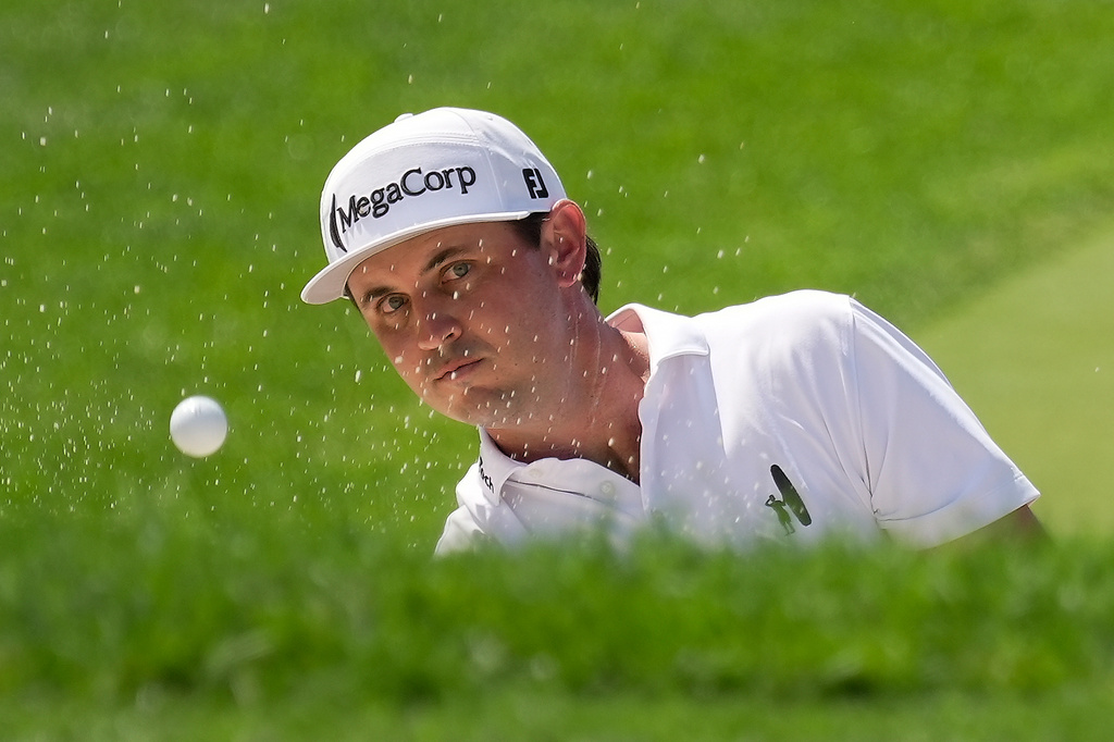 J.T. Poston hits from a bunker to the 18th green during the second round of the Memorial golf tournament in Dublin, Ohio, Friday, June 5, 2026. (AP Photo/Sue Ogrocki)