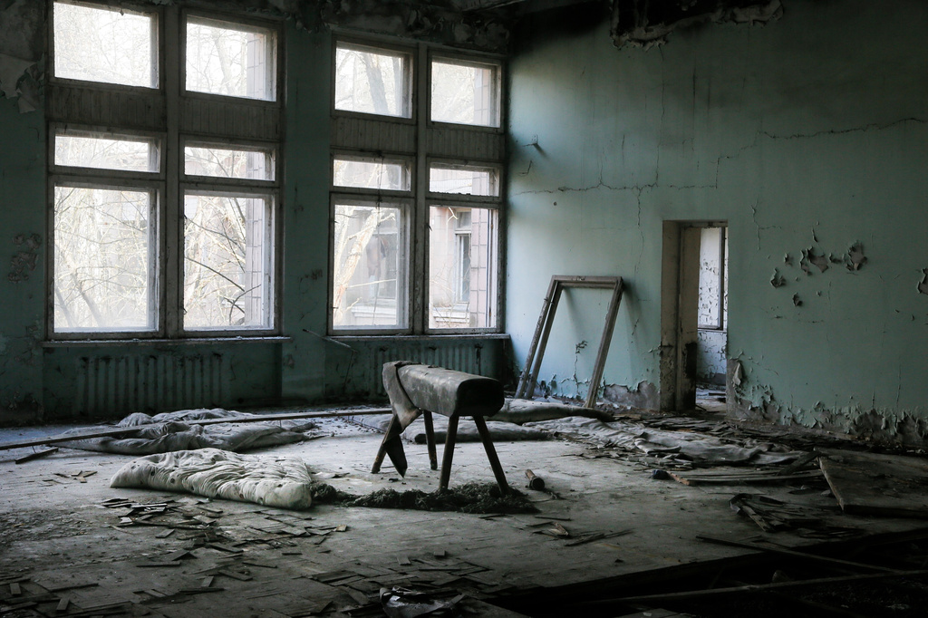 FILE - A pommel horse sits in a school gymnasium in the deserted town of Pripyat, Ukraine, April 5, 2017, once home to people whose lives were connected to the nearby Chernobyl nuclear power plant. (AP Photo/Efrem Lukatsky, File)