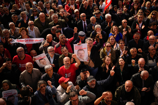 People shout slogans during a rally in support of Istanbul's imprisoned opposition Mayor Ekrem Imamoglu as he appears for a hearing, at the Caglayan courthouse, in Istanbul, Turkey, Sunday, Oct. 26, 2025. The poster with the photo of Imamoglu reads in Turkish: "Turkey will win". (AP Photo/Emrah Gurel) People shout slogans during a rally in support of Istanbul's imprisoned opposition Mayor Ekrem Imamoglu as he appears for a hearing, at the Caglayan courthouse, in Istanbul, Turkey, Sunday, Oct. 26, 2025. The poster with the photo of Imamoglu reads in Turkish: "Turkey will win". (AP Photo/Emrah Gurel)