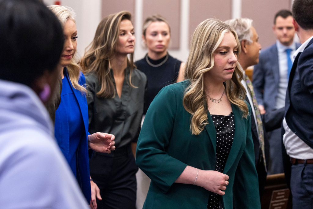 Abigail "Abby" Zwerner exits the courtroom after hearing the verdict in her lawsuit against the assistant principal, Ebony Parker, of Richneck Elementary School during proceedings at Newport News Circuit Court on Thursday, Nov. 6, 2025. (Kendall Warner/The Virginian-Pilot via AP)