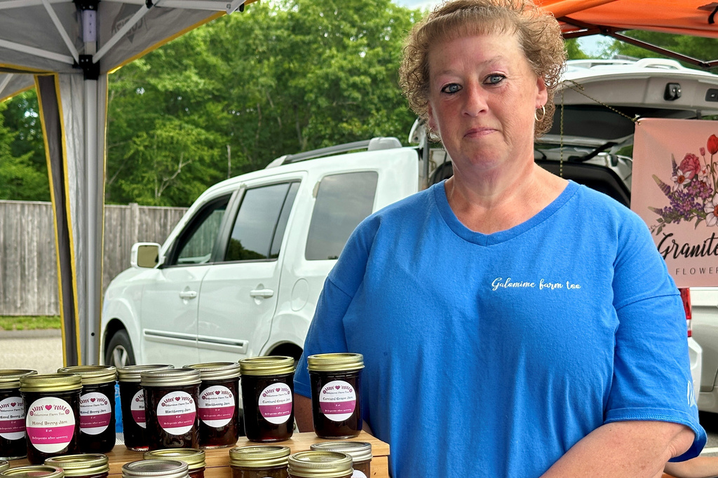 Mindy Dean poses for a photo at the farmers market in Bedford, N.H., Tuesday, June 30, 2026. (AP Photo/Holly Ramer)