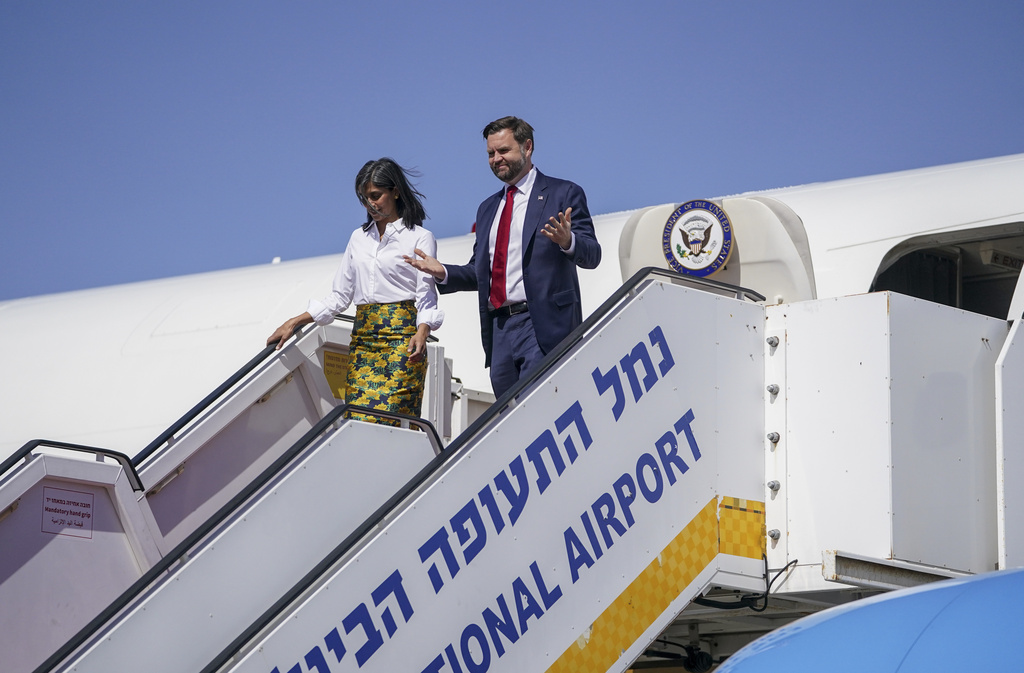 Vice President J.D. Vance, right, and Second Lady Usha Vance arrive at Ben Gurion airport in Tel Aviv, Israel, Tuesday, Oct. 21, 2025. (Nathan Howard/Pool Photo via AP)