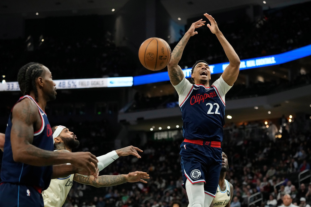 LA Clippers' Jordan Miller loses control of the ball after being fouled during the first half of an NBA basketball game against the Milwaukee Bucks, Sunday, March 29, 2026, in Milwaukee. (AP Photo/Aaron Gash)
