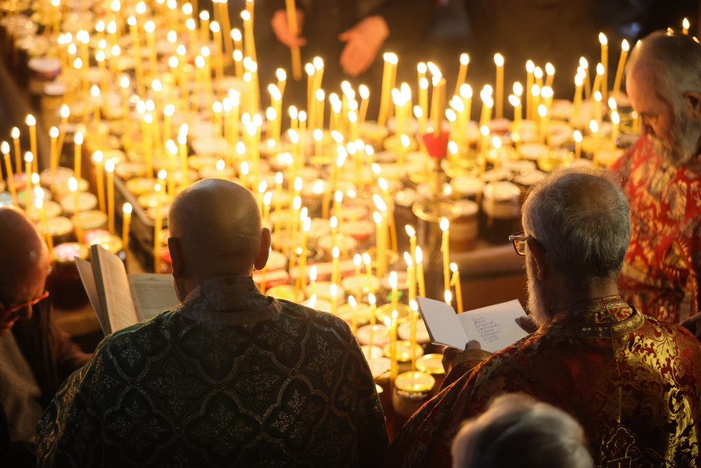 Orthodox priests preside at a service for the “sanctification of honey,” at the Presentation of the Blessed Virgin Church in the town of Blagoevgrad, Bulgaria, Tuesday, Feb.10, 2026, marking the feast day of St. Haralambos, the Orthodox patron saint of beekeepers. (AP Photo/Valentina Petrova)