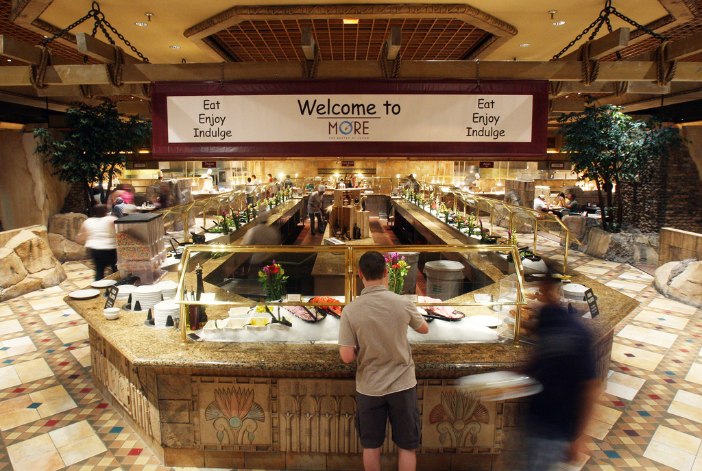 FILE - Guests graze the More buffet at the Luxor hotel & casino Friday, May 22, 2009, in Las Vegas. (AP Photo/Isaac Brekken, File)