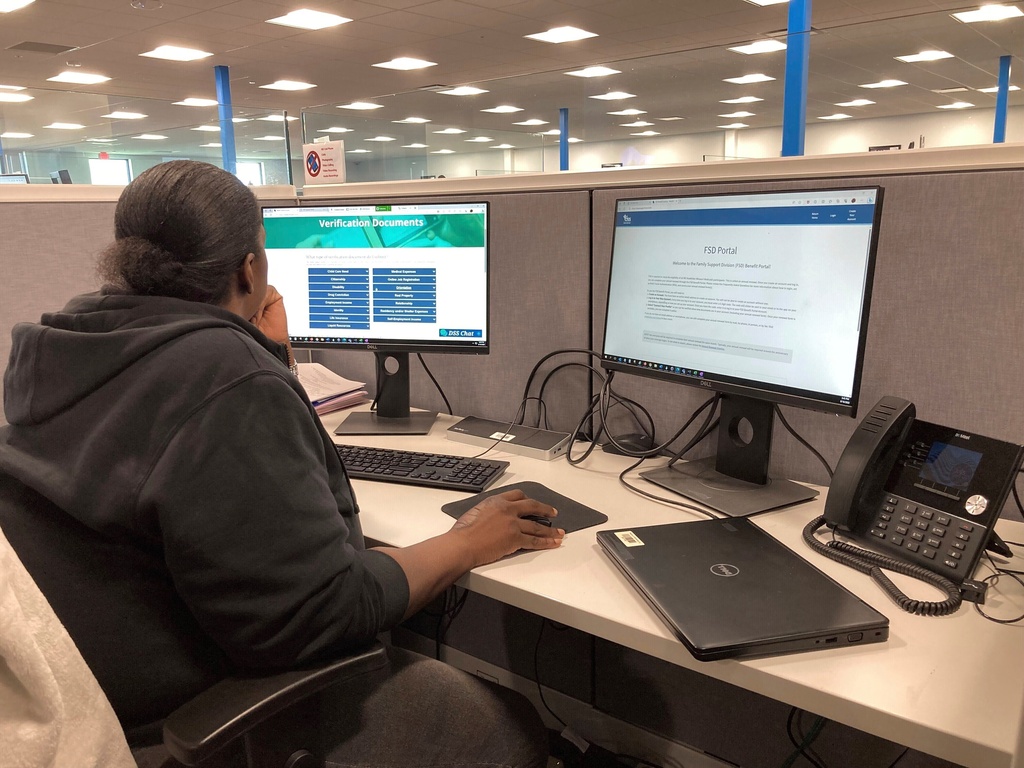 FILE - A worker at a Medicaid call center reviews information regarding eligibility determinations on Wednesday Aug. 16, 2023 in Jefferson City, Mo. (AP Photo/David A. Lieb, File)