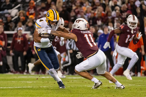 California wide receiver Jordan King (4) gets by Virginia Tech safety Tyson Flowers (11) during the first half of an NCAA college football game between California and Virginia Tech, Friday Oct. 24, 2025, in Blacksburg, Va., (AP Photo/Robert Simmons) California wide receiver Jordan King (4) gets by Virginia Tech safety Tyson Flowers (11) during the first half of an NCAA college football game between California and Virginia Tech, Friday Oct. 24, 2025, in Blacksburg, Va., (AP Photo/Robert Simmons)
