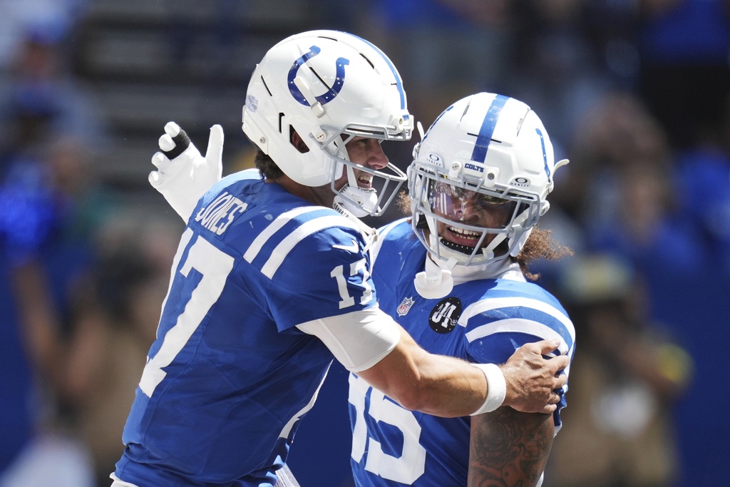 Indianapolis Colts quarterback Daniel Jones (17) celebrates his touchdown with teammate Drew Ogletree during the first half of an NFL football game against the Miami Dolphins on Sunday, Sept. 7, 2025, in Indianapolis. (AP Photo/Darron Cummings)