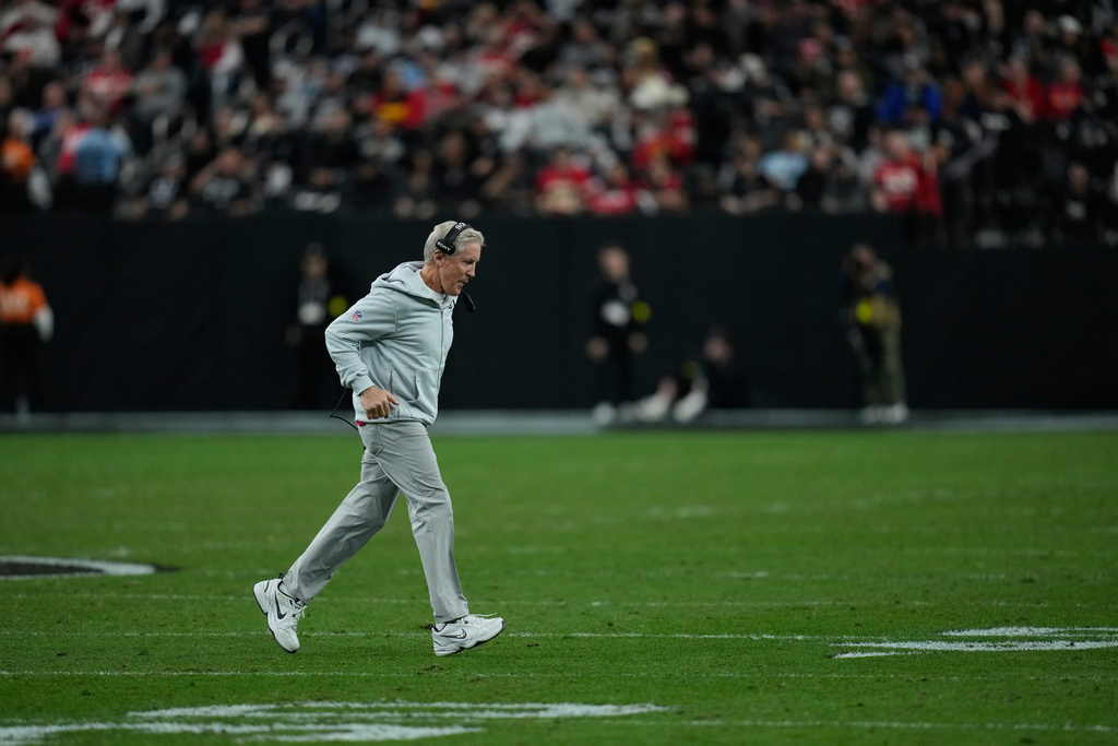 Las Vegas Raiders head coach Pete Carroll jogs on the field during timeout in the first half of an NFL football game against the Kansas City Chiefs Sunday, Jan. 4, 2026, in Las Vegas. (AP Photo/John Locher)