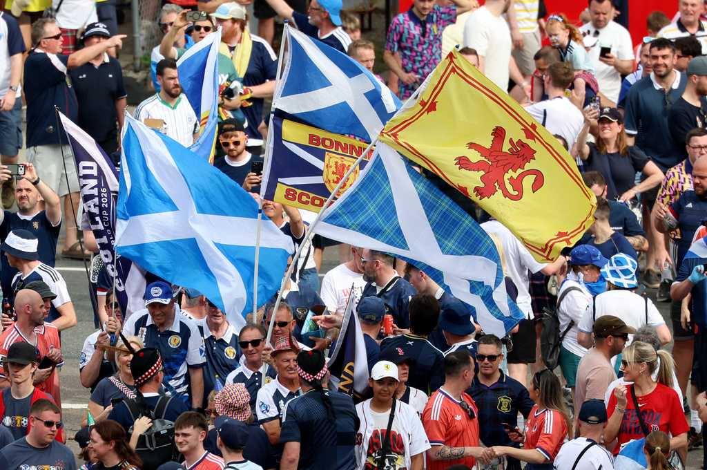 Thousands of Scotland soccer fans take part in the Tartan Army March, making their way to Fenway Park ahead of a baseball game between the Boston Red Sox and the Texas Rangers, Sunday, June 14, 2026, in Boston. (AP Photo/Mark Stockwell)