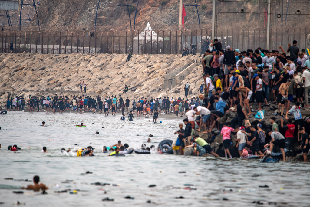 Migrants return to Morocco from the Spanish enclave of Ceuta, Friday, July 31, 2026. (AP Photo/Antonio Sempere)