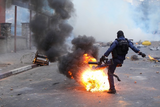 Madagascar police react to protesters demonstrating against chronic electricity and water cuts in Antananarivo, Madagascar, Tuesday, Sept. 30, 2025. (AP Photo/Mamyrael) Madagascar police react to protesters demonstrating against chronic electricity and water cuts in Antananarivo, Madagascar, Tuesday, Sept. 30, 2025. (AP Photo/Mamyrael)