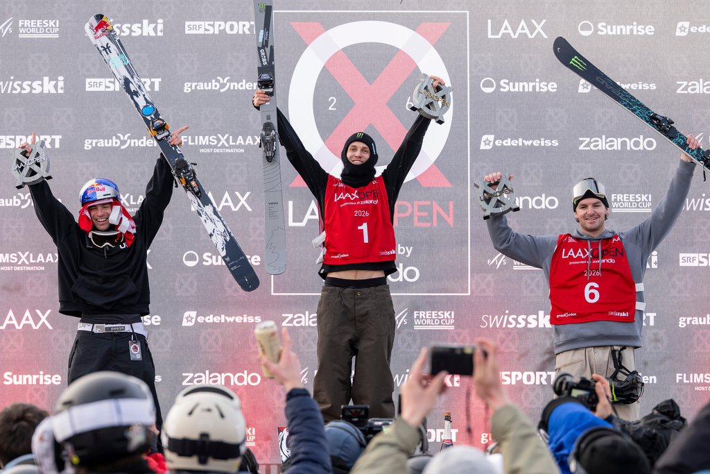 Winner Birk Ruud of Norway, center, second placed Matej Svancer of Austria, left, and third placed Evan Mceachran of Canada celebrate on the podium after the final run of the Freeski Slopestyle World Cup at the Laax Open, in Laax, Switzerland. (Andreas Becker/Keystone via AP)